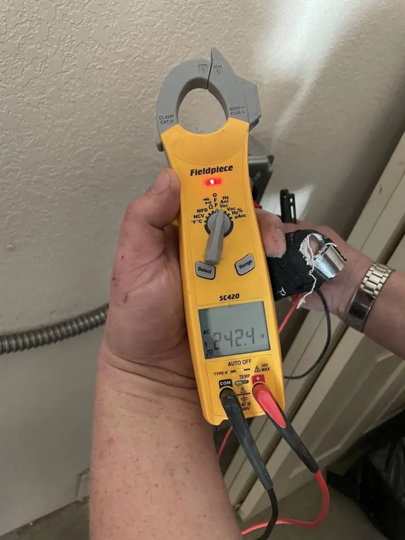 Voltage testing with clamp meter during Outlet Installation in Scandia